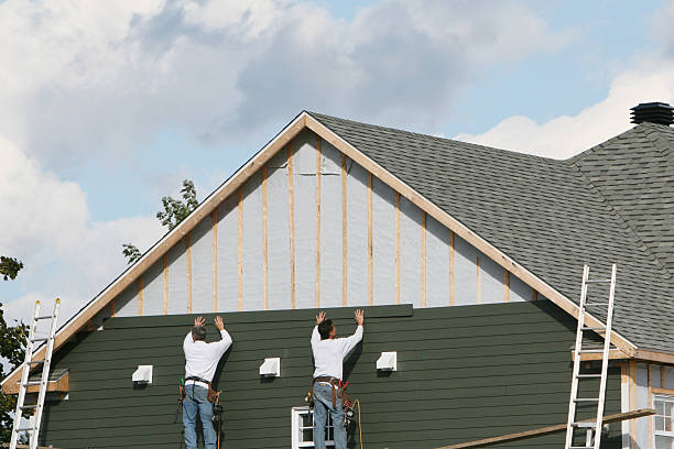 Professional Storm Damage Siding Repair technician working in Kernersville, NC